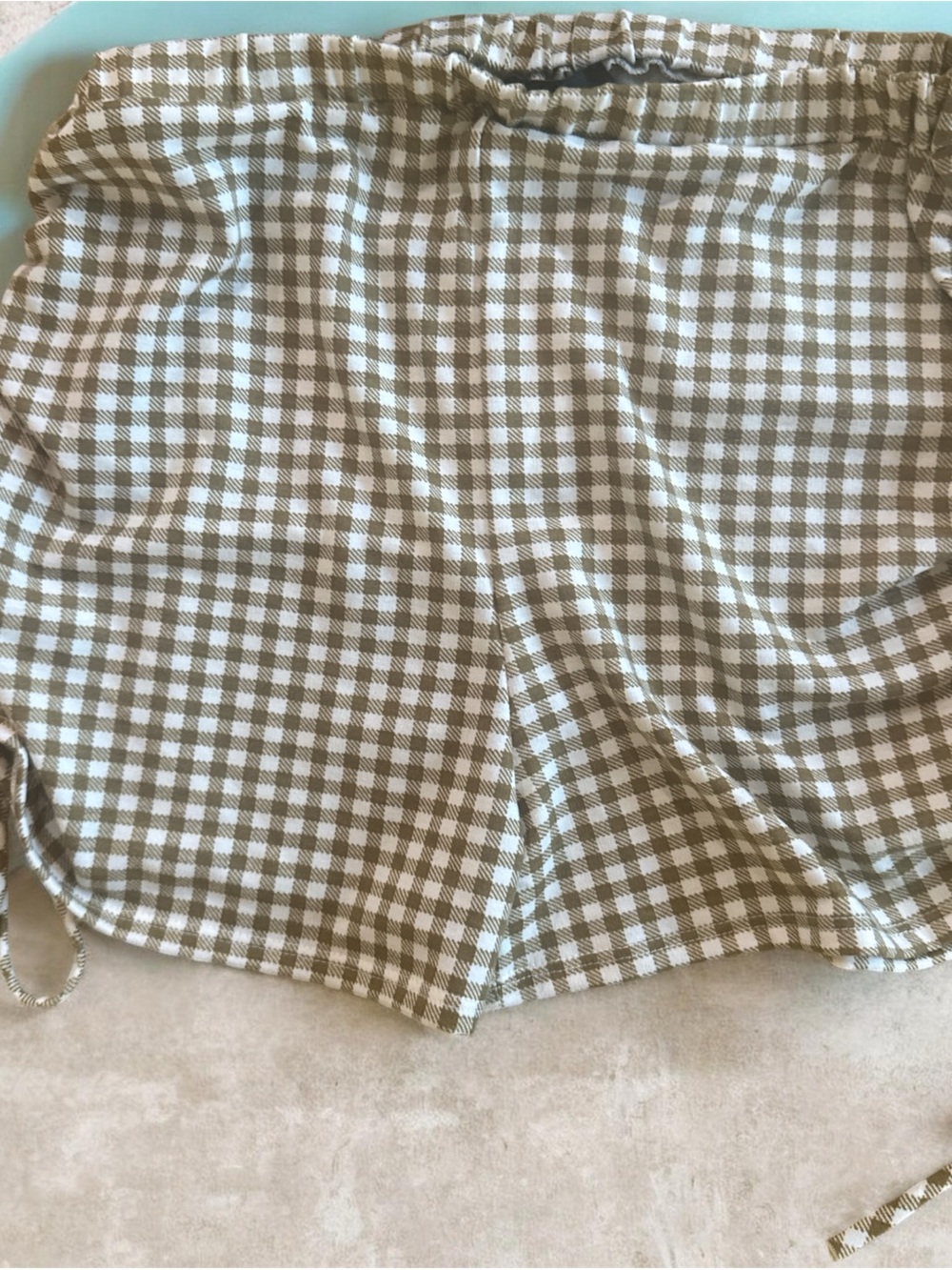 Gingham Drawstring Bermuda Shorts in Olive and White. Size medium
